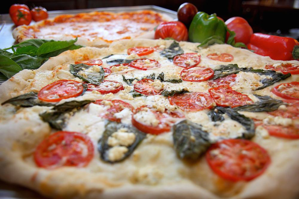 Pizza with fresh tomatoes and basil